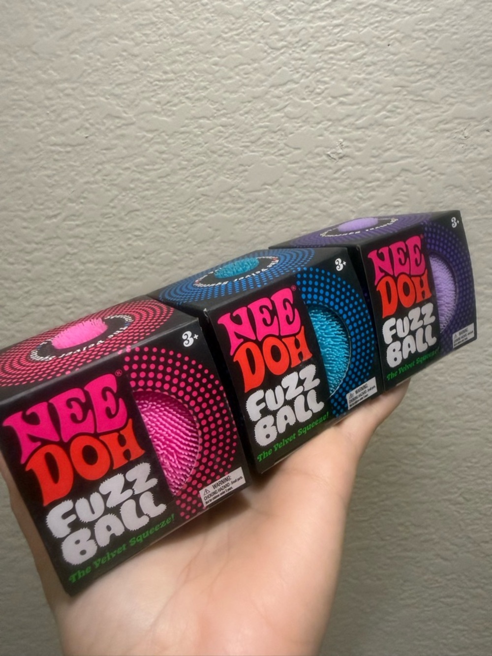 Bundle of 3 Needoh. Fuzz ball in pink, blue & purple. NEW. Viral squishes